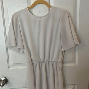 Sheer white high low blouse with peplum sleeves. Size small